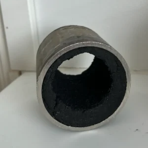 Thick layer of fouling on the inside of a pipe